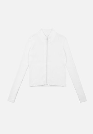 Biała, prążkowana, krótsza kurtka zapinana na zamek błyskawiczny z podwyższonym kołnierzem, długimi rękawami i gładkim zapięciem. Prosty design, strukturalny materiał.