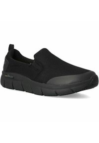 Scarpe slip-on nere con tomaia in rete testurizzata, punta rinforzata e suola spessa e imbottita. Accentuate da un'etichetta antiscivolo.
