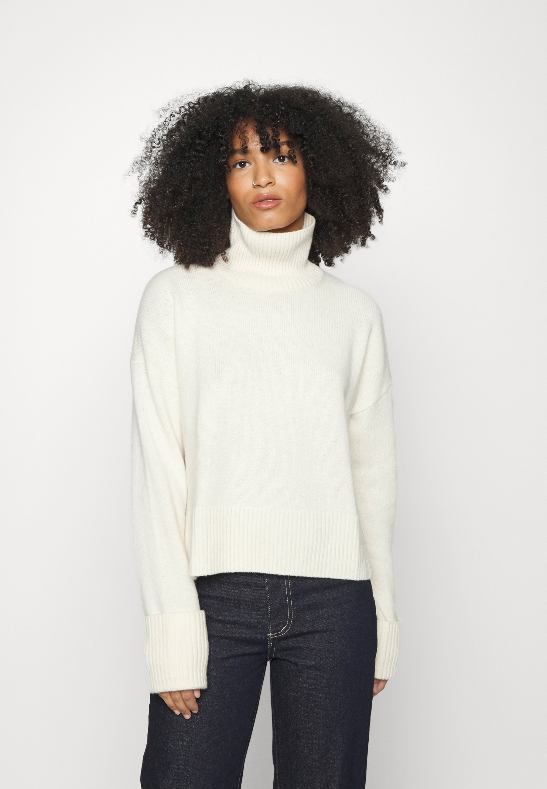 white jumper turtleneck