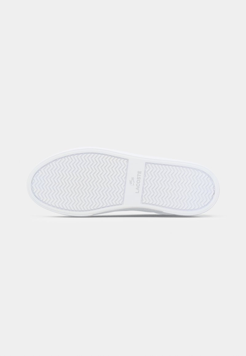 White footwear sole with a herringbone pattern. Smooth rubber material, featuring a logo in the center. Rounded toe and flat design.