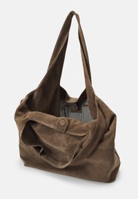 Brown suede tote bag with a soft texture, large opening, and long handles. Interior features striped lining and a zip pocket.