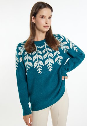 Teal knitted sweater with white leaf pattern, round neckline, and ribbed cuffs. Relaxed fit with a slightly asymmetrical hem.