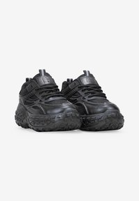 Black athletic shoes with mesh and synthetic upper, textured sole, padded tongue, and adjustable laces; slim design with a rugged tread pattern.