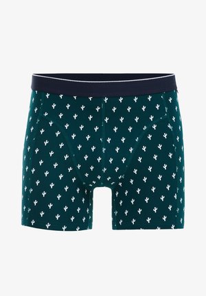 Férfi boxeralsó sötétzöld anyagból, fehér kaktusz mintával, tengerészkék elasztikus derékrésszel és szoros illeszkedésű kialakítással.