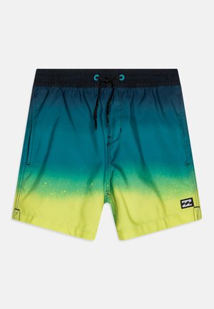 Men's swim shorts made of lightweight fabric, featuring a gradient from dark teal to bright yellow, with black drawstring and logo patch.