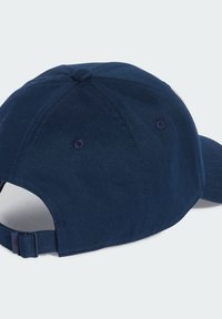 Navy blue cotton baseball cap with curved visor, adjustable strap, and stitched details. Features a back opening for ventilation.