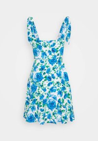 Sukienka w kwiaty z dopasowanym stanem, wzorem niebieskich i zielonych kwiatów na białym tle oraz wiązaniami na ramionach, z rozkloszowanym dołem.