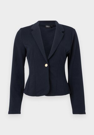 Marineblå tettsittende blazer med lange ermer, hakkede slag og én gyllen knapp foran.
