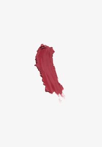 Macchia di rossetto matt mauve-rosa con una finitura testurizzata e polverosa su sfondo bianco.
