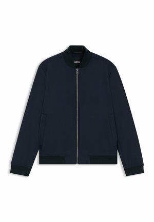 Navy bomber jacket made of smooth fabric, featuring a front zipper, side pockets, ribbed cuffs, and a round neckline.