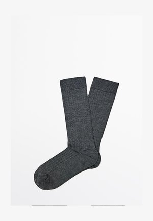 Pair of dark gray ribbed crew-length socks laid flat on a white background.