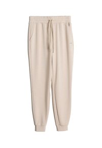 Beige joggebukser laget av mykt stoff, med elastisk linning og snøring, sidelommer og mansjetter på bunnen.