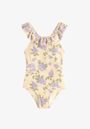Hihaton beige one-piece uimapuku, jossa on laventelinsininen kukkakuvio ja röyhelökaulus valkoisella taustalla.