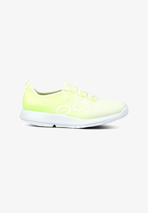 Lime green athletic shoe with a smooth, lightweight fabric upper, white laces, and a white rubber sole; features embossed side details.