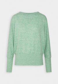 Ljusgrön, texturerad tröja med avslappnad passform, vid halsringning och långa ärmar. Har ribbade mudd och fåll. Bakifrån visad.