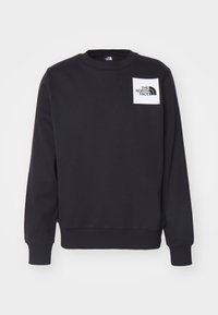 Sudadera negra hecha de una mezcla de algodón, con cuello redondo, mangas largas y un parche de logo cuadrado en blanco en el lado izquierdo del pecho.