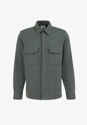 Roheline nööbitav särk, millel on kaelus, kaks rinna taskut, nupud ja pikad varrukad koos mansettide detailidega. Pehme kangast tekstuur.