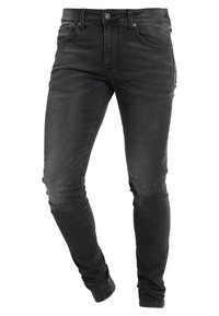 Jeans de mezclilla negra slim-fit con un acabado descolorido, diseño de cinco bolsillos y cierre de botón. Presentan un ligero estiramiento y costuras minimalistas.