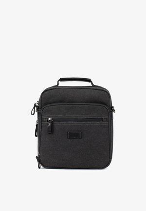 Sac bandoulière compact en tissu noir avec plusieurs compartiments zippés et une poignée supérieure pour le transport.