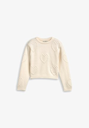 Kremowy, krótki sweter z dzianinowym wzorem serca, z prążkowanym dekoltem i mankietami oraz miękkim, teksturowanym materiałem na całej powierzchni.