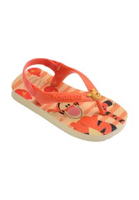 Tongs pour enfant orange et beige avec imprimé Tigrou, bride de talon rouge réglable et décoration ourson jaune sur la bride orange.