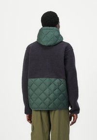 Helly Hansen STOWE HOODED HYBRID JACKET UNISEX - Zimní bunda - jungle green