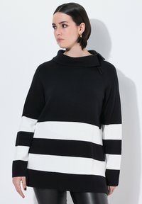 Zwart-wit gestreepte pullover trui met een col, lange mouwen, ribbelstructuur en een relaxte pasvorm. Kenmerkend horizontaal patroon.