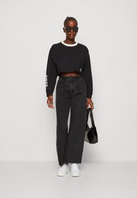 Levi's Graphic Hoodie In Our Mother Crop Caviar