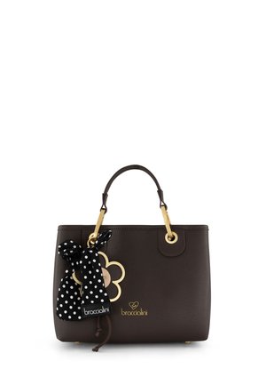 Borsa a mano in pelle marrone scuro con manici dorati, foulard a pois bianco e nero annodato e emblema floreale dorato con logo del marchio.