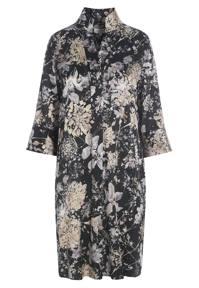 Robe noire longueur genoux avec motif floral beige et blanc, manches 3/4 et col montant.