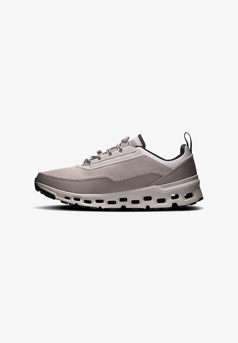 Light gray athletic shoe with a textured fabric upper, stitched accents, cushioned sole, and black rubber outsole. Lacing system included.