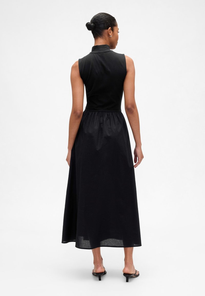 mock neck mixed media midi dress Vince Camuto Mixed Media Sweater Bodice Mock Neck Sleeveless Satin Drop Waist Trapeze Flounce Midi Dress at Hamilton Place in Chattanooga, TN