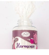 Clear glass jar filled with white bath salt. Label features purple background with floral design and the word "Harmonie" in bold, purple text.