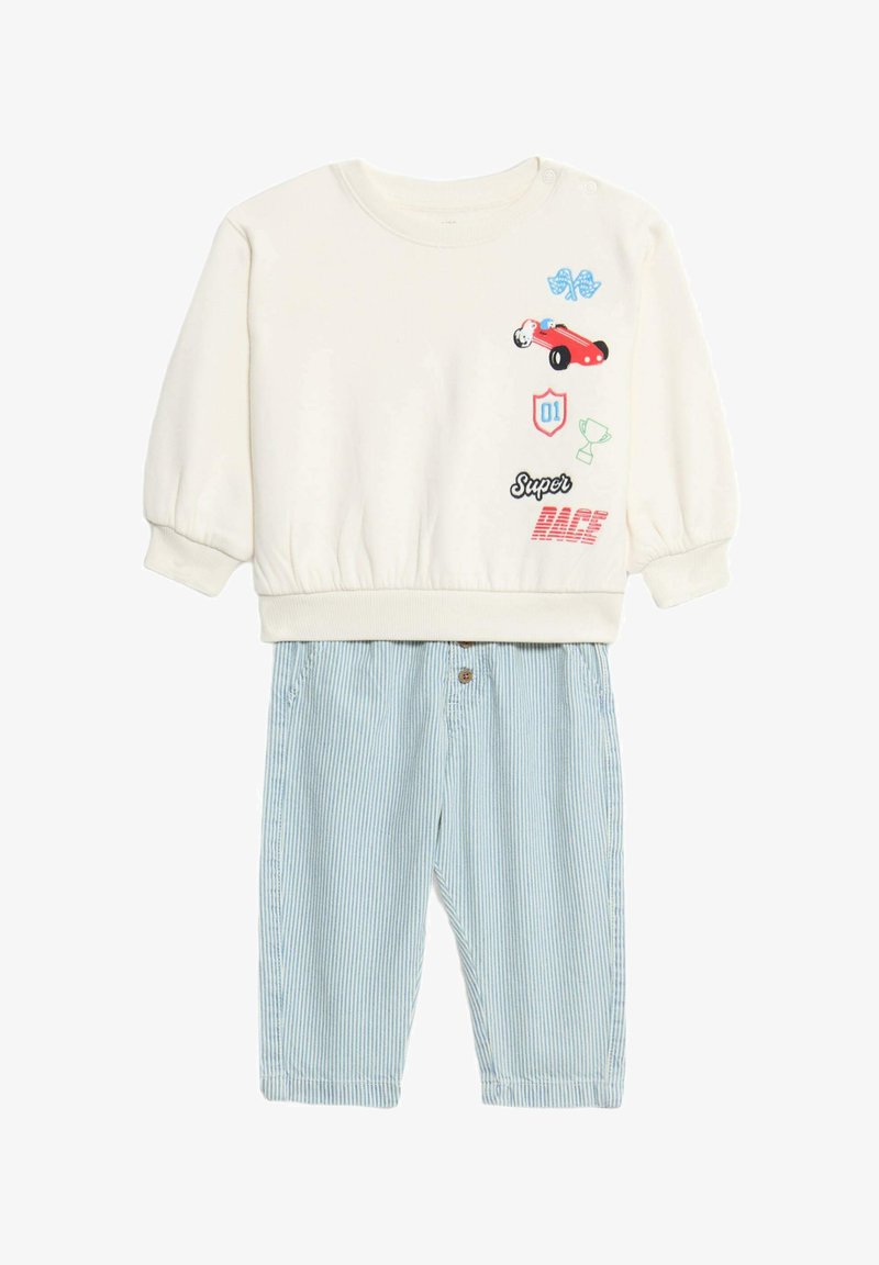 Crème sweatshirt met grafische afbeeldingen, elastische manchetten, gecombineerd met lichtblauwe gestreepte shorts met een knoopsluiting en zakken.