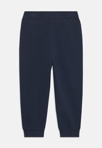 Pantalones jogger azul marino hechos de una suave mezcla de algodón, con una cinturilla y puños acanalados, diseñados para la comodidad y la facilidad de movimiento.