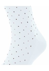 Weiße Socke mit einem gepunkteten Muster aus kleinen sandfarbenen und lavendelfarbenen Punkten, mit glatter Textur und verstärktem Fersenbereich.