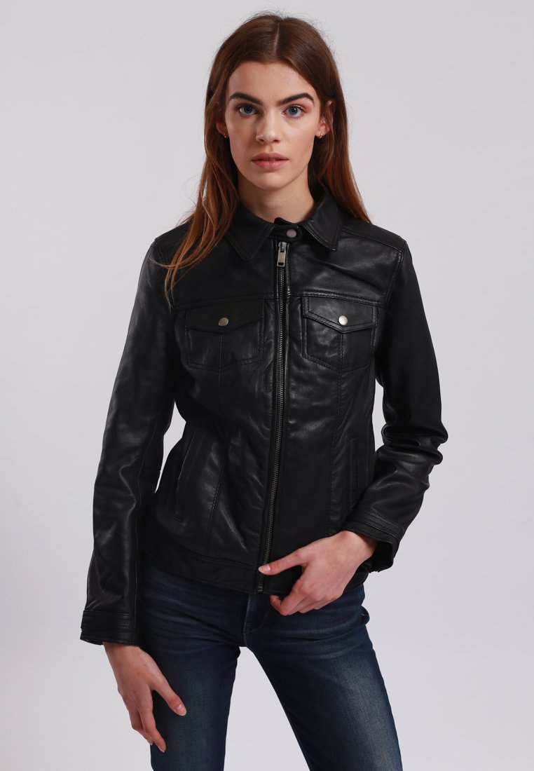 Black leather jacket with a zip front, two chest pockets, and a classic collared design. Smooth texture and fitted silhouette.