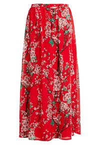 Jupe maxi rouge avec un motif floral de fleurs de cerisier roses et de feuilles vertes, taille élastique et tissu fluide.