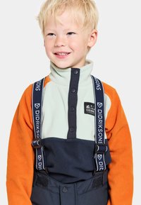 Fleecejacka med en mintgrön, marinblå och orange färgblockdesign, tryckknappar och justerbara remmar med varumärke.