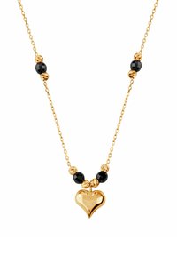 Złoty naszyjnik z sercem w kształcie wisiorka, zdobiony fasetowanymi czarnymi koralikami i teksturowanymi złotymi separatorami.
