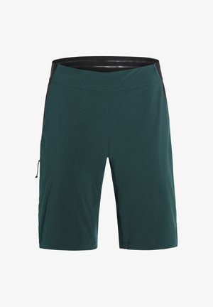 Donkergroene shorts tot op de knie met een zwarte elastische tailleband en een ritssluitingzak aan de rechterkant.