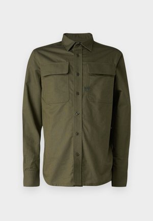 Olive green long-sleeve shirt, button-down design, two chest pockets, smooth texture, and a brand label on the left pocket.
