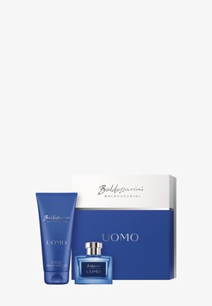 Tube de gel douche Blue Baldessarini Uomo, bouteille de parfum assortie et boîte d'emballage de marque bleue et blanche.