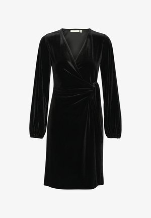Czarna aksamitna sukienka o kroju kopertowym z długimi bufiastymi rękawami, głębokim dekoltem w kształcie litery V, wiązaniem z boku i gładką fakturą. Długość do połowy uda. Prosty, elegancki design.
