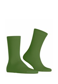 Grüne Baumwollsocken mit geripptem Muster, knielanger Gestaltung und verstärktem Zehenbereich. Das weiche Material sorgt für eine glatte Oberfläche ohne Muster.