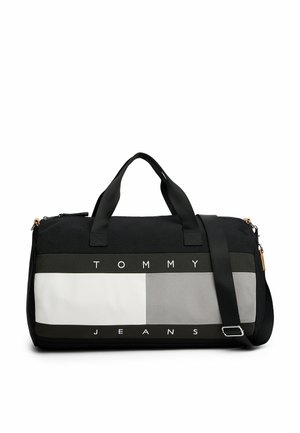 Borsone nero e grigio con sezioni a contrasto, testo "TOMMY JEANS" in grassetto, manici doppi e una tracolla regolabile.