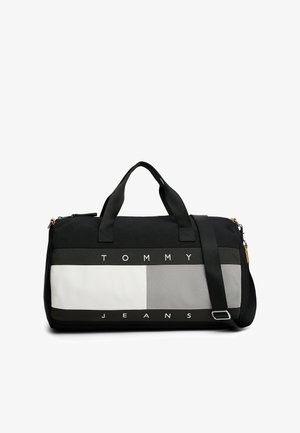 Borsone nero e grigio con sezioni a contrasto, testo "TOMMY JEANS" in grassetto, manici doppi e una tracolla regolabile.