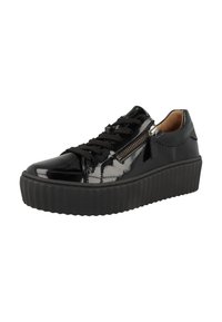 Baskets en cuir verni noir avec une semelle plateforme épaisse, dotées d'un design à lacets et d'un détail de fermeture éclair sur le côté. Surface lisse avec semelle striée.