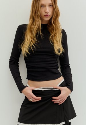 Långärmad tröja - black