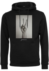 Black hoodie with a large central graphic of a hand forming a peace sign, featuring "peace" text below the image in a cursive font.